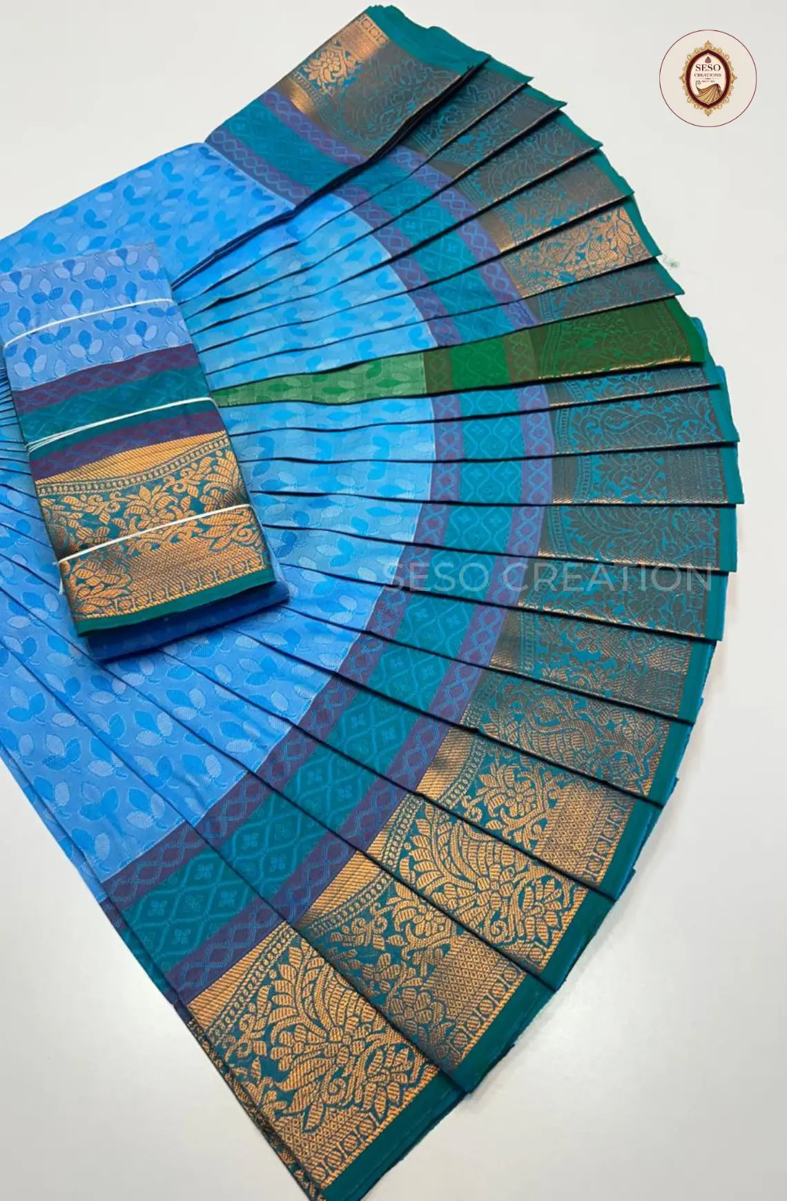 Pavithra Plain Emboss Semi Silk Saree - Bright Blue