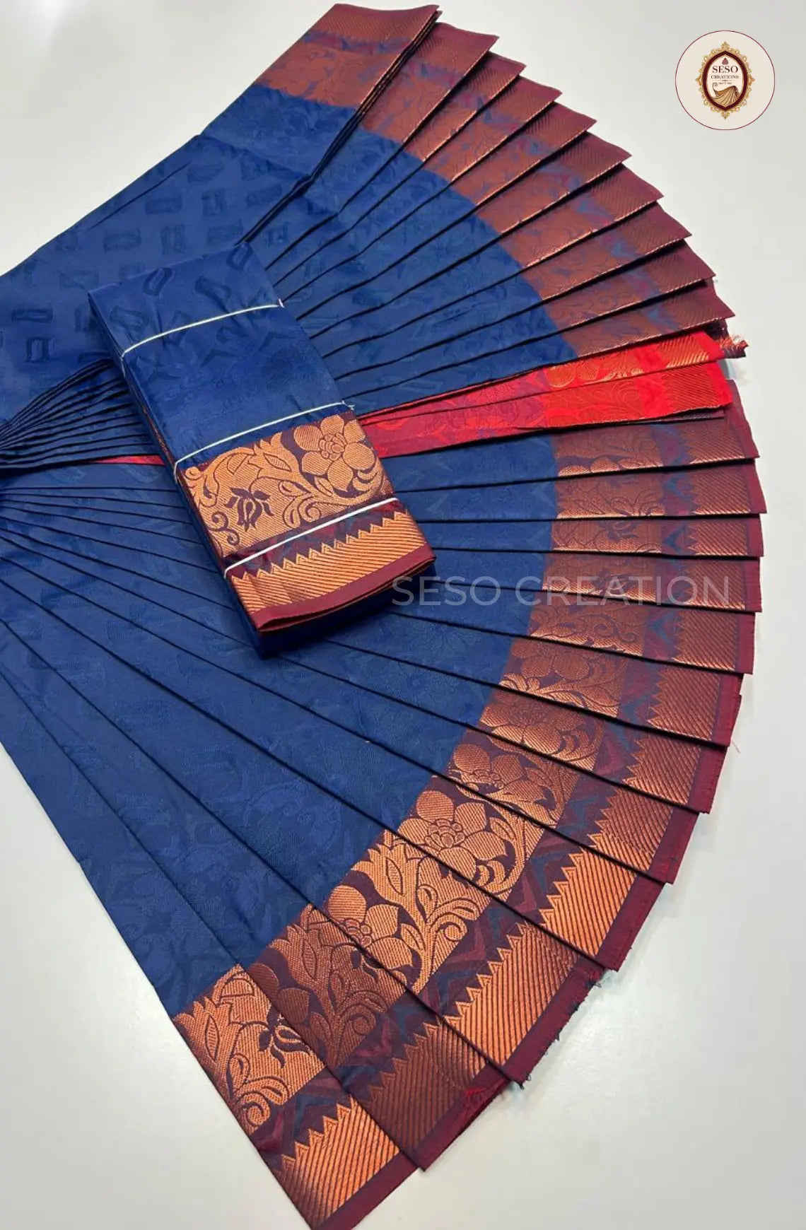 Pavithra Plain Emboss Semi Silk Saree - Dark Blue