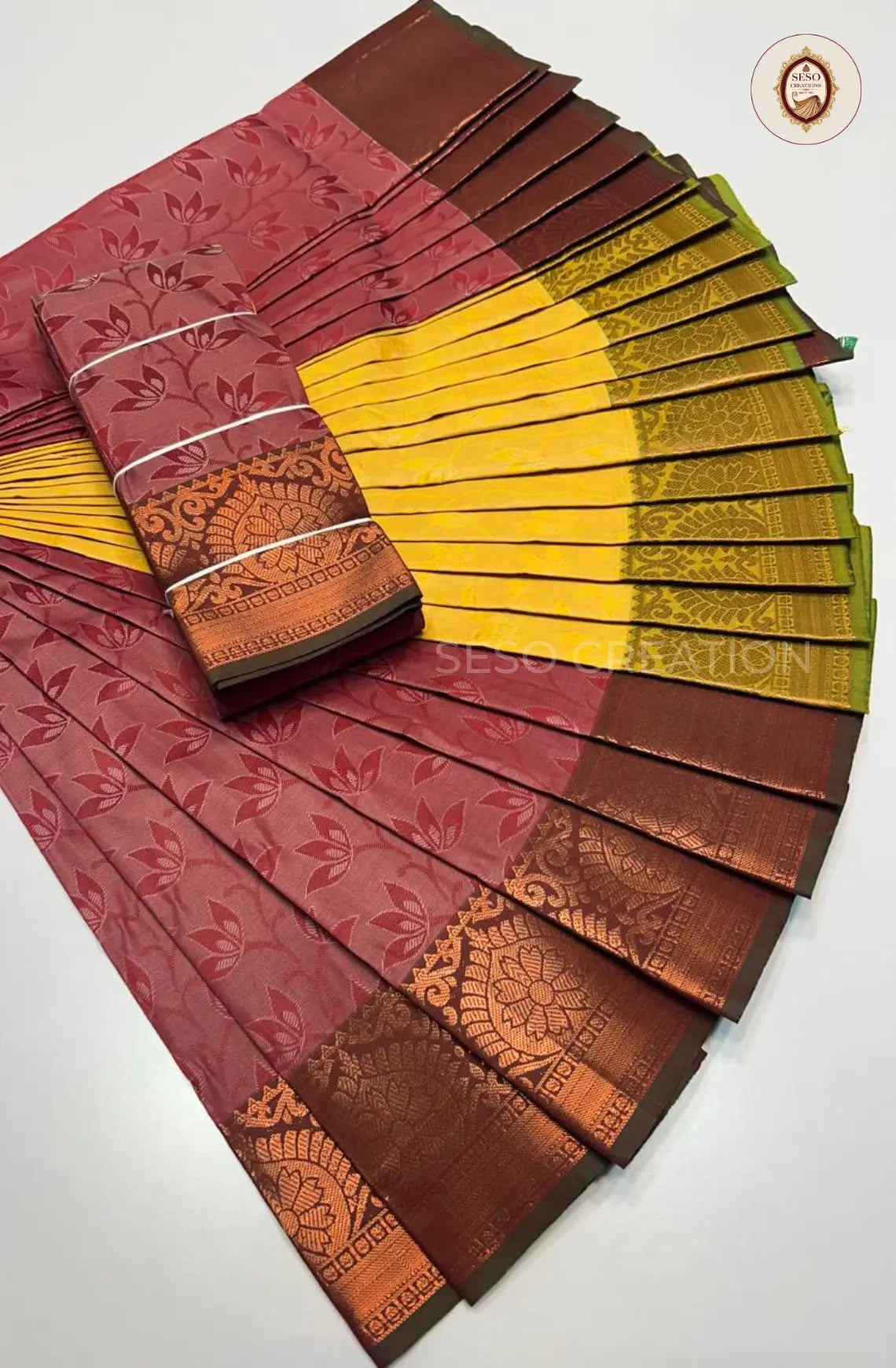 Pavithra Plain Emboss Semi Silk Saree - Maroon