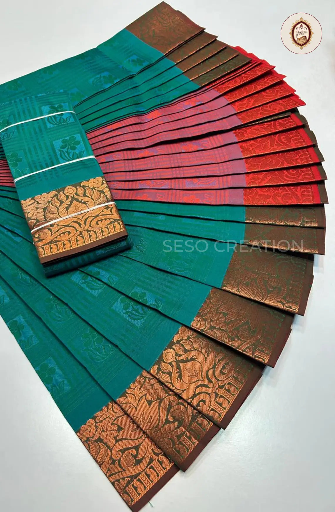 Pavithra Plain Emboss Semi Silk Saree - Mayil