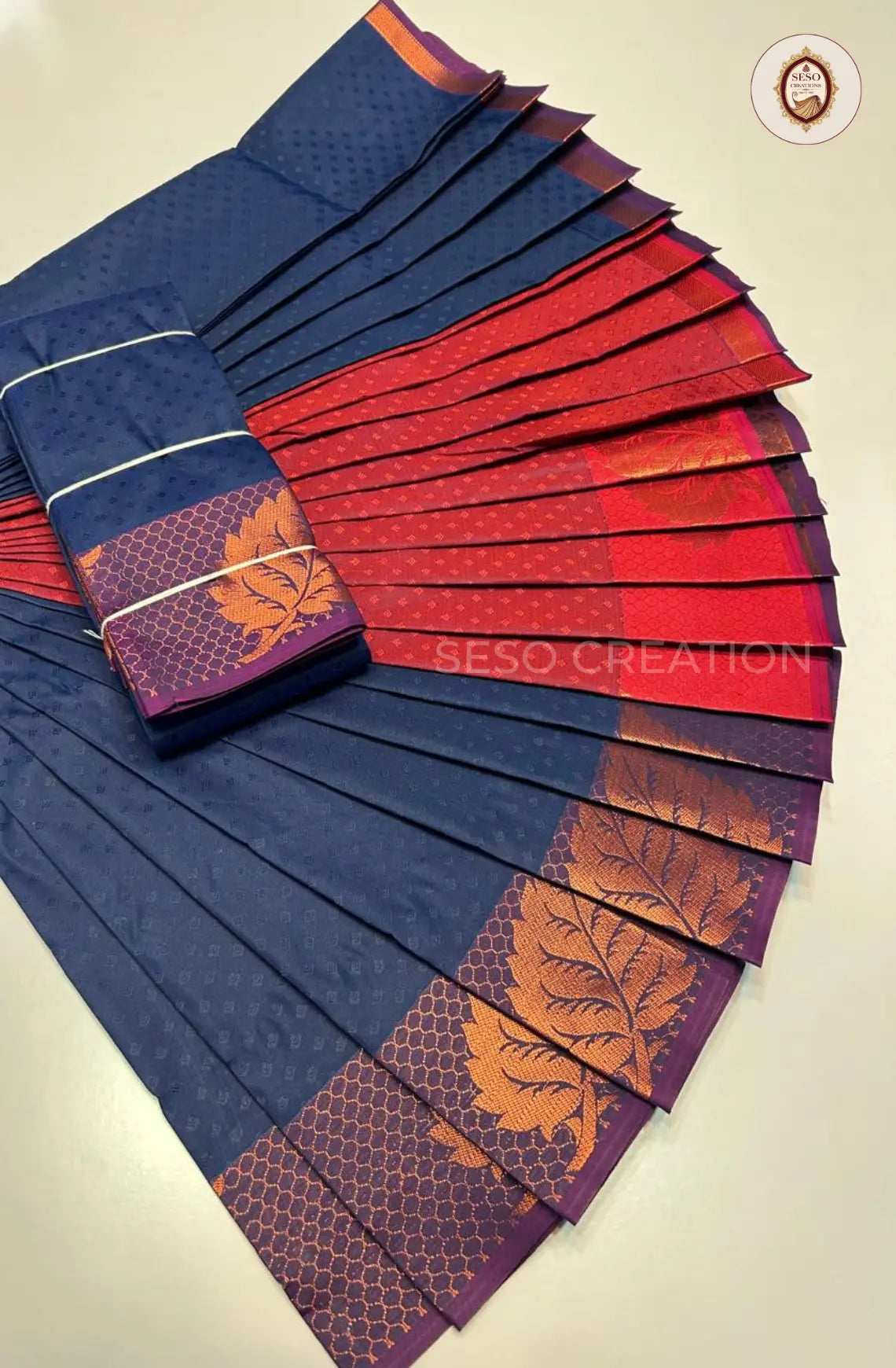 Pavithra Plain Emboss Semi Silk Saree - Navy Blue