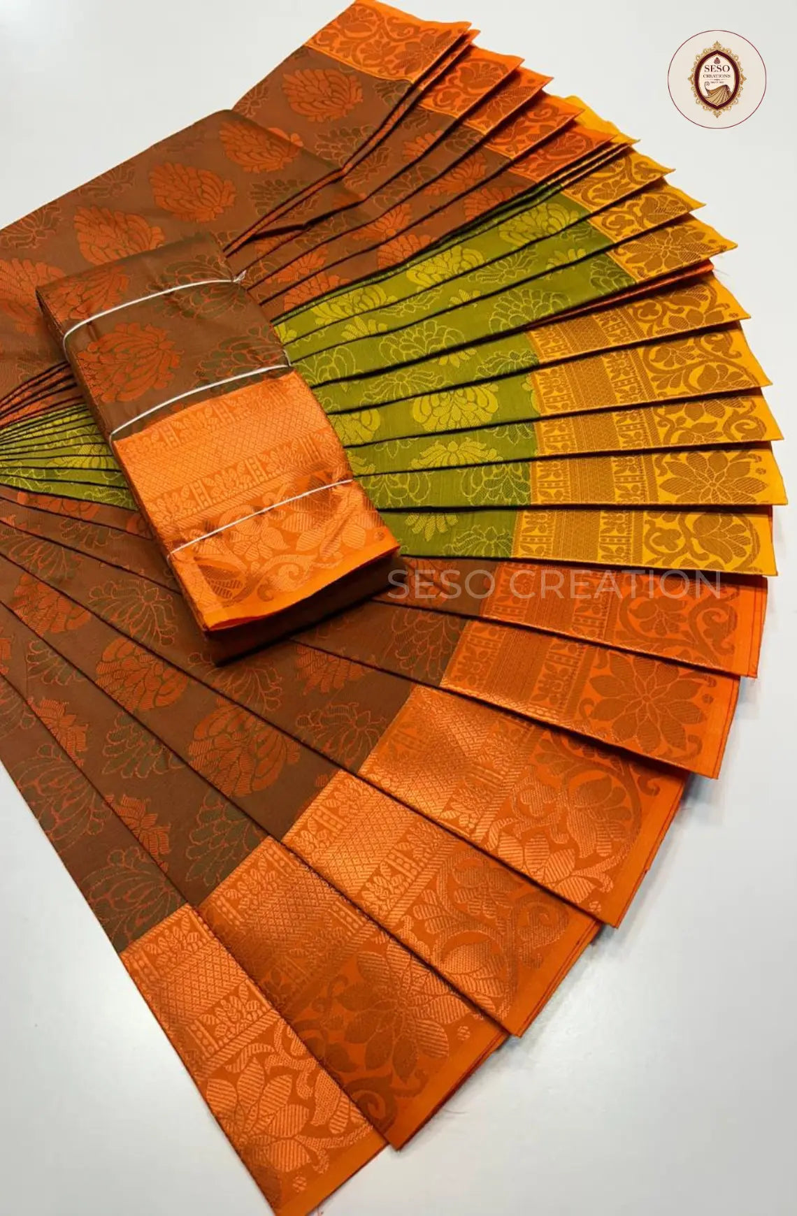 Pavithra Plain Emboss Semi Silk Saree - Rust Brown