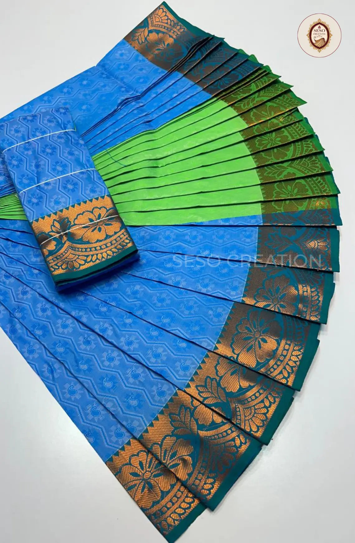 Pavithra Plain Emboss Semi Silk Saree - Sky Blue