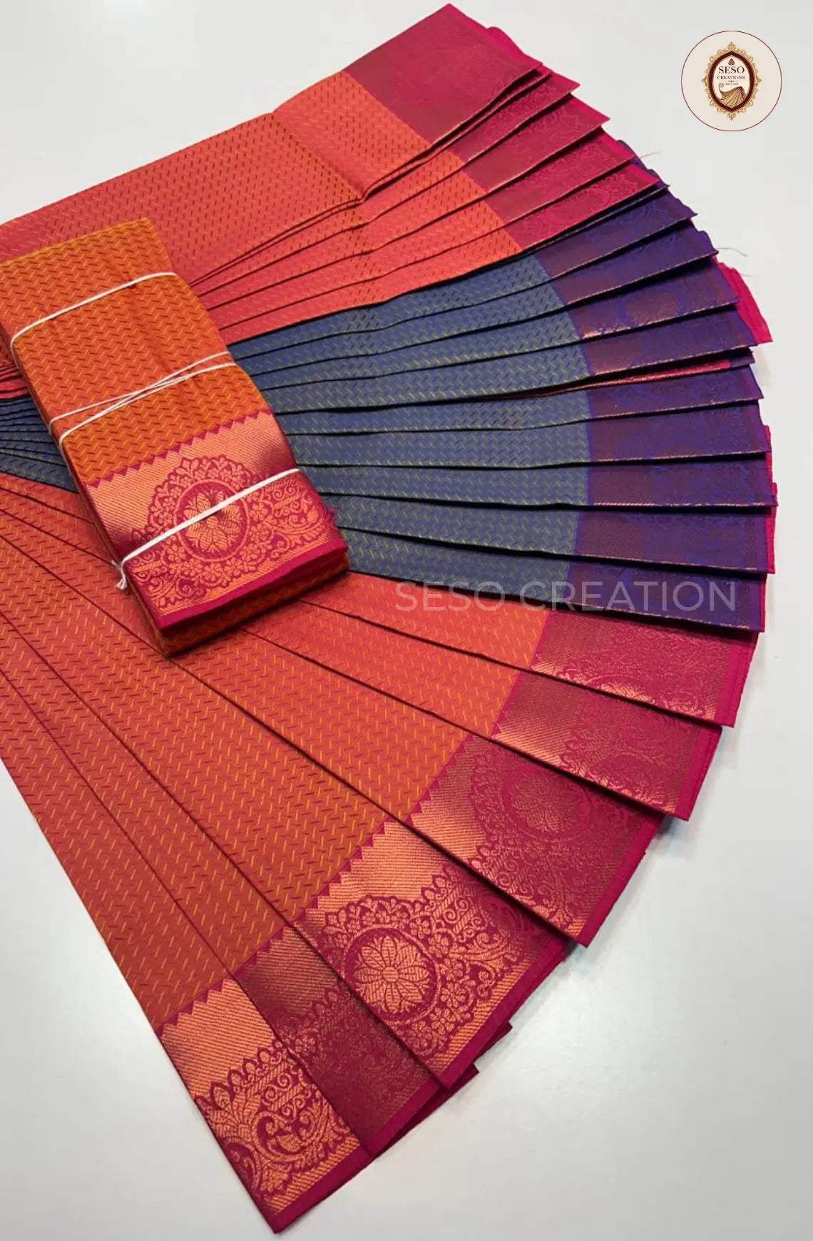 Pavithra Plain Emboss Semi Silk Saree - Tomato Red